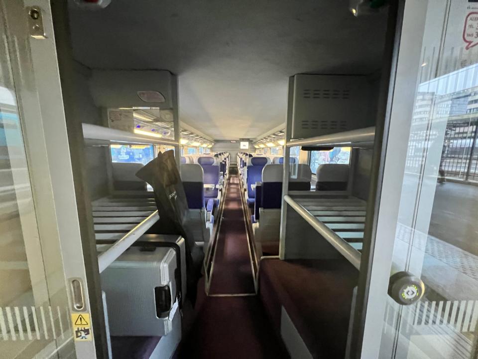 Luggage racks next to the carriage entrance on a TGV Lyria