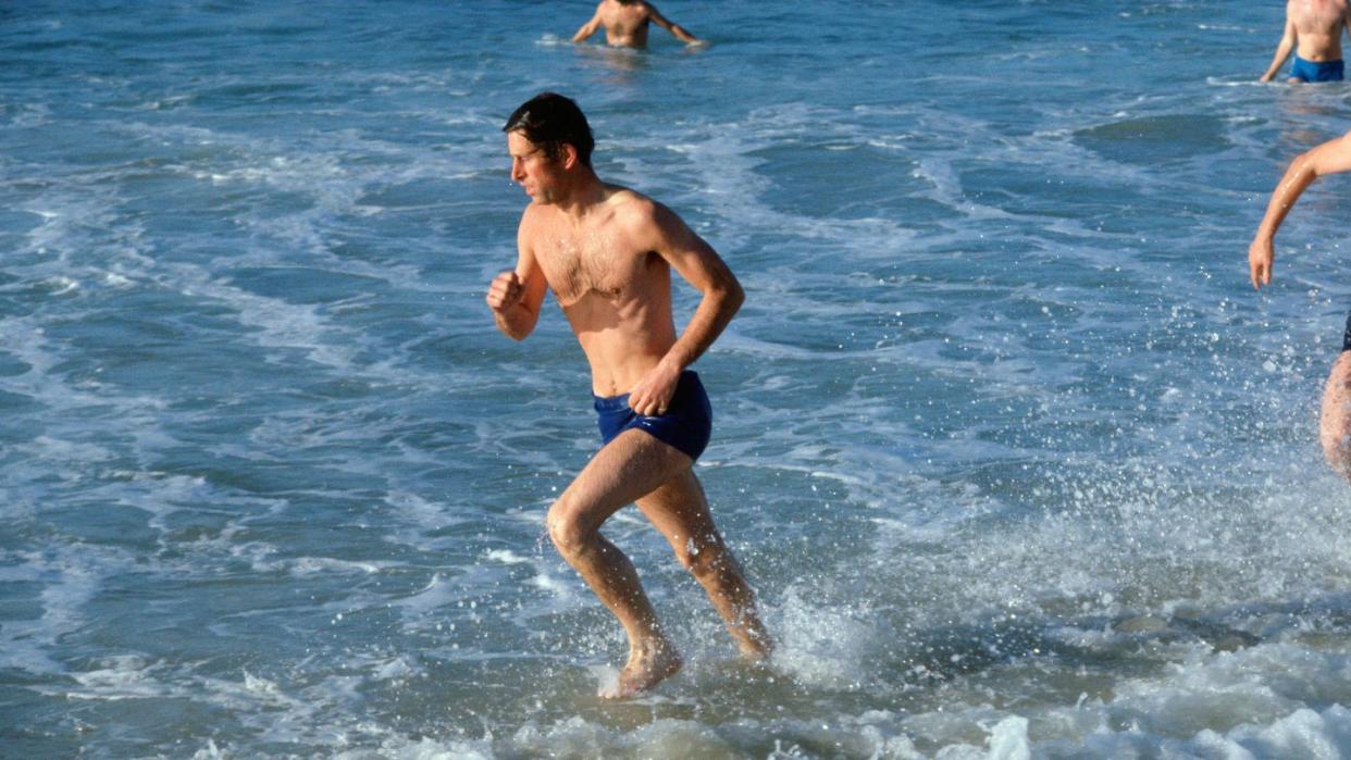 Prince Charles, Prince of Wales in the sea at Bondi Beach as