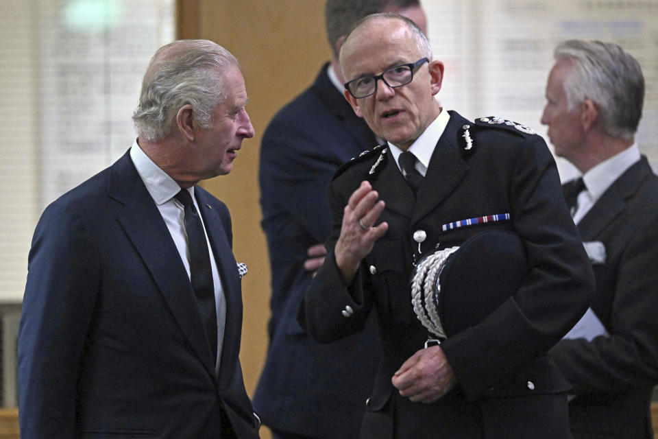 Britain's King Charles III speaks with Metropolitan Police Commissioner Mark Rowley during a visit to the Metropolitan Police Service during a visit to thank them for their work and support, ahead of the funeral of late Queen Elizabeth II in London, Saturday, Sept. 16, 2022. (Carl de Souza/Pool via AP)