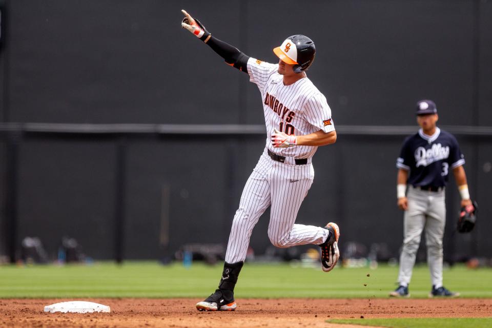 Oklahoma State outfielder Nolan Schubart (10) hits a home run during a game in the NCAA Stillwater Regional between the Oklahoma State Cowboys (OSU) and the Dallas Baptist Patriots at O'Brate Stadium in Stillwater, Okla., on Saturday, June 3, 2023.