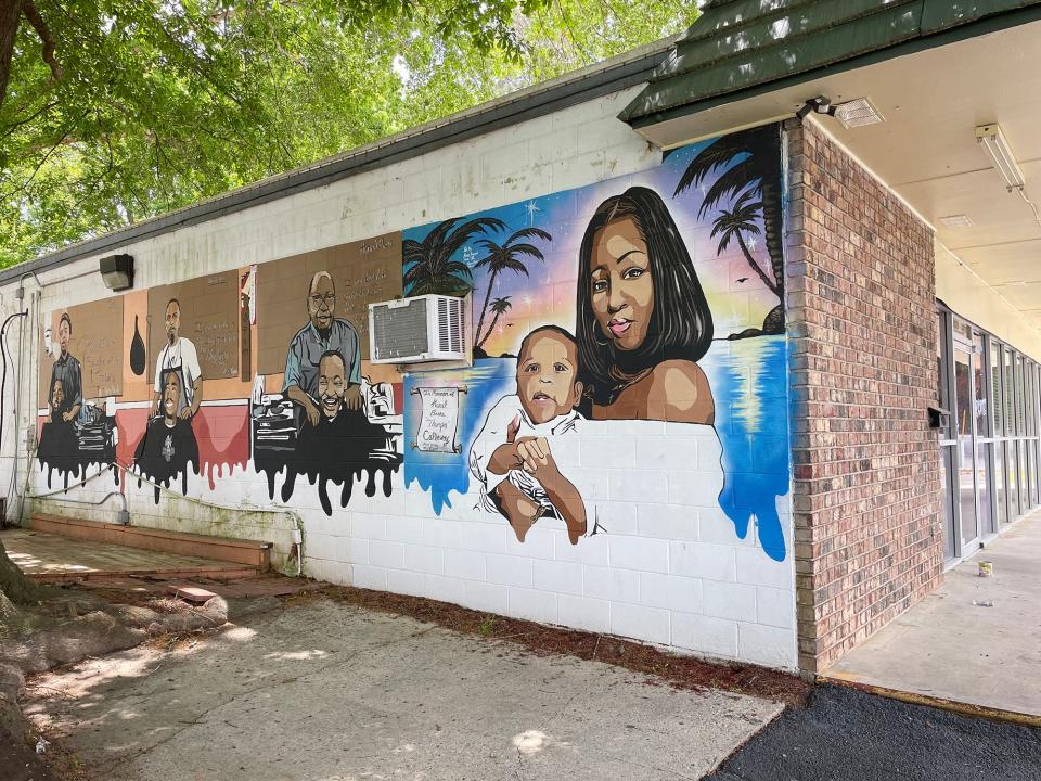 This photo taken at Kelly's Authentic Jamaican Food shows a mural on the side of the building at 145 Epps Bridge Road in Athens, Ga. Owner Kelly Codling is closing the location after 10 years and is unsure about what will happen to the mural.