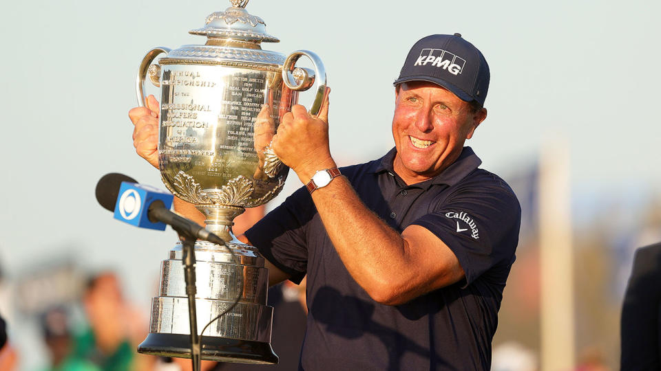 Seen here, Phil Mickelson holds the PGA Championship trophy aloft.