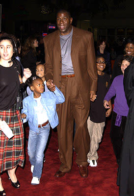 Magic Johnson and family at the Westwood premiere of Warner Brothers' Harry Potter and The Sorcerer's Stone