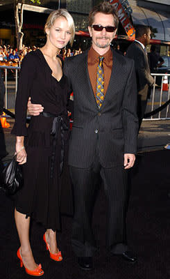 Gary Oldman with Alisa Marshall at the Hollywood premiere of Warner Bros. Pictures' Batman Begins