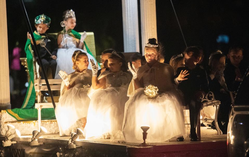 Members of the Edison Festival of Light Junior Royalty wave to the crowd during the Edison Festival of Light Parade on Saturday, Feb. 18, 2023, in Fort Myers.