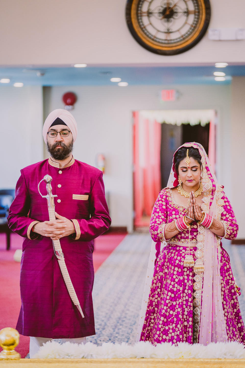 Rupam and Nitin doing Ardas, a prayer to seek blessings after the Sikh wedding ceremony, called the Anand Karaj. (A.S. Nagpal Photography)