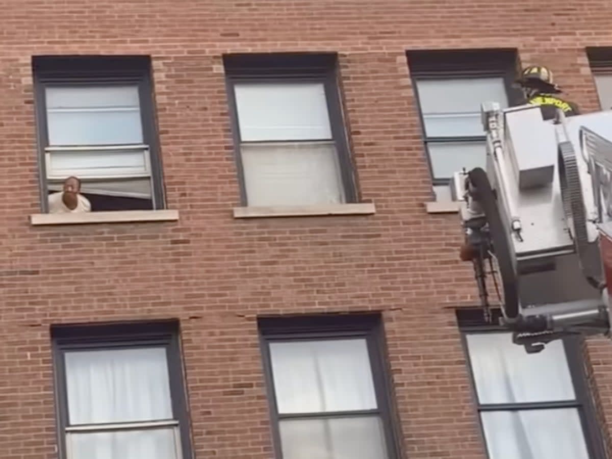 Firefighters are seen rescuing Lisa Brooks from the Iowa building collapse (Pauletta Joeanna)