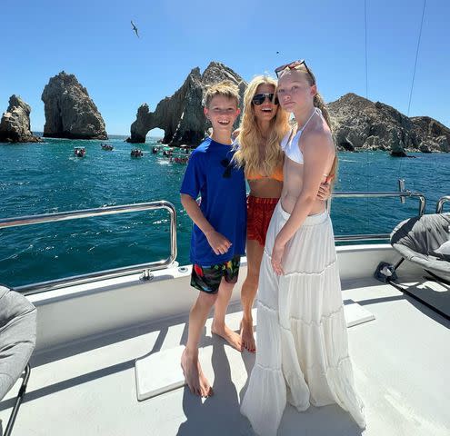 <p>Jessica Simpson/Instagram</p> Jessica Simpson poses next to daughter Maxwell and son Ace on a yacht