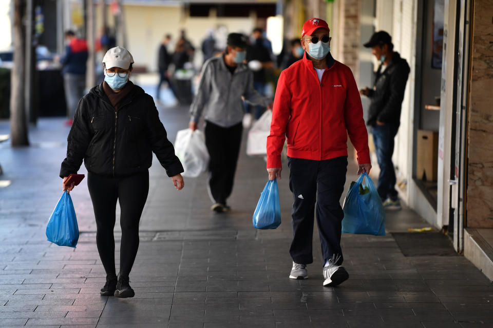 Shoppers wearing face masks at Bankstown in Sydney, Friday, July 30, 2021. Source: AAP