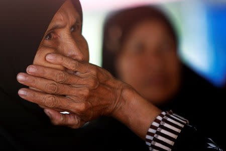 Cambodian Muslims sit at the the Extraordinary Chambers in the Courts of Cambodia (ECCC), as they wait for a verdict on the former Khmer Rouge head of state Khieu Samphan and former Khmer Rouge leader ''Brother Number Two'' Nuon Chea, on the outskirts of Phnom Penh, Cambodia, November 16, 2018. Reuters/Samrang Pring