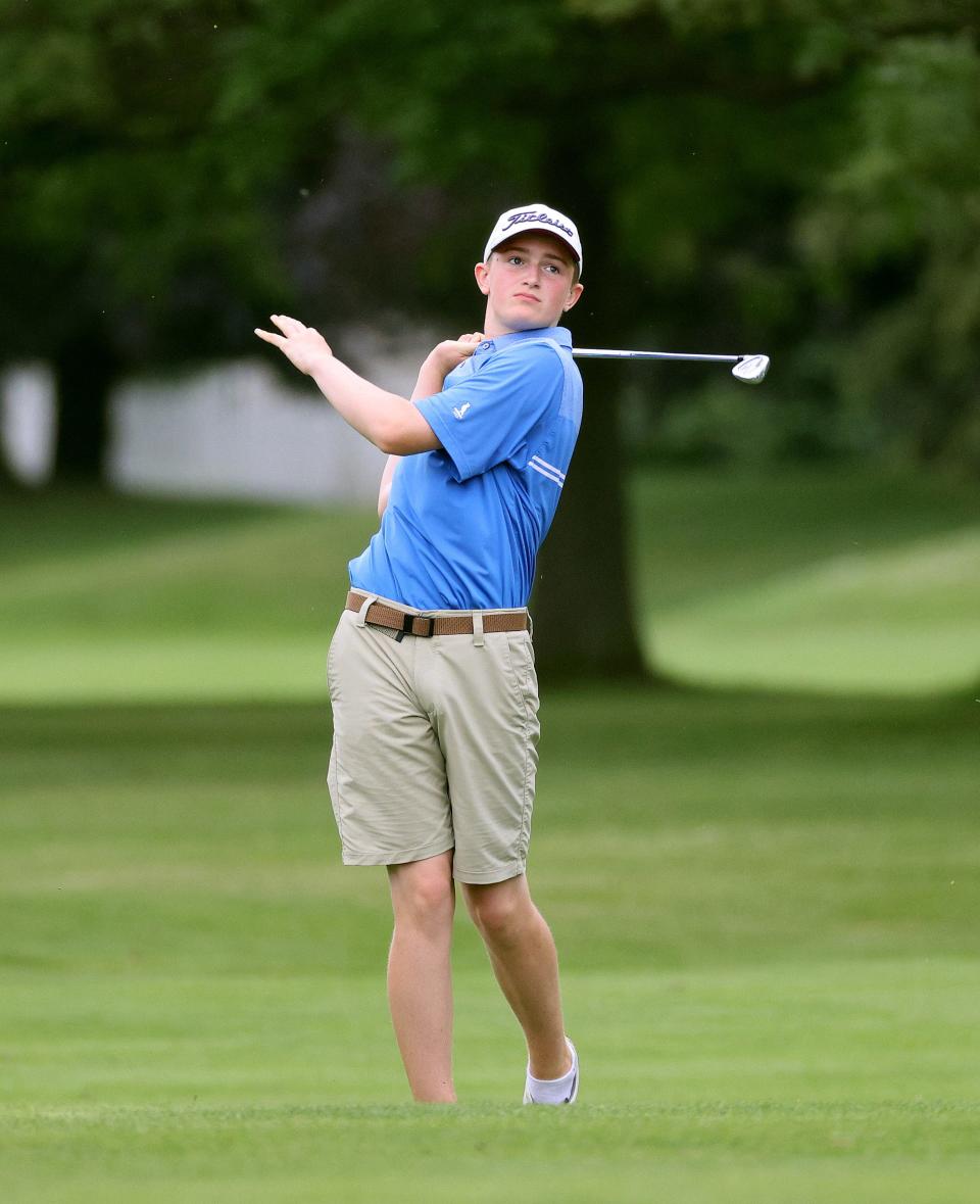 Owen Corby  watches his shot from the 10th fairway at Webster Golf Club. 