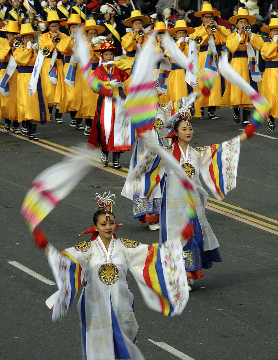 Performers with the PAVA World Korean Traditional Marching Band march in the 124th Rose Parade in Pasadena, Calif., Tuesday, Jan. 1, 2013. (AP Photo/Reed Saxon)