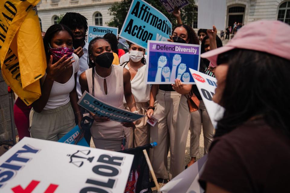 Affirmative action supporters and opponents rally outside the Supreme Court