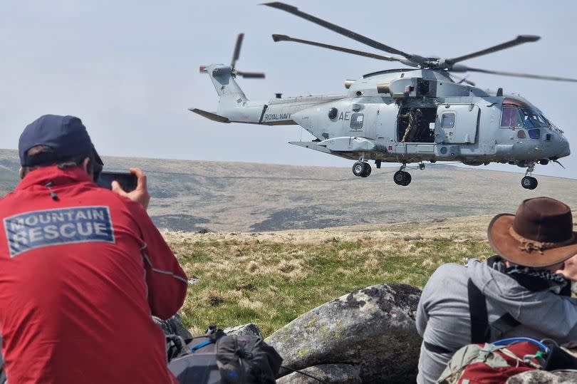 Army helicopter and search and rescue crew