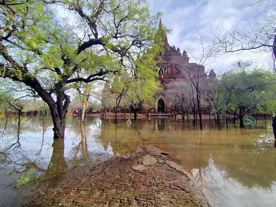 In this photo provided by Myanmar Military True News Information Team on Monday, May 15, 2023, a flooded area caused by Cyclone Mocha is seen near old temple in Bagan, central Myanmar. Rescuers early Monday evacuated about 1,000 people trapped by seawater 3.6 meters (12 feet ) deep along western Myanmar's coast after the powerful cyclone injured hundreds and cut off communications. (Military True News Information Team via AP)