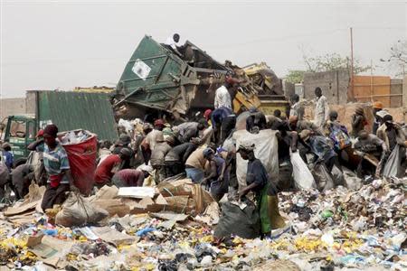 Scavengers at the Olusosun dump site in Nigeria's commercial capital Lagos March 23, 2012. REUTERS/Akintunde Akinleye