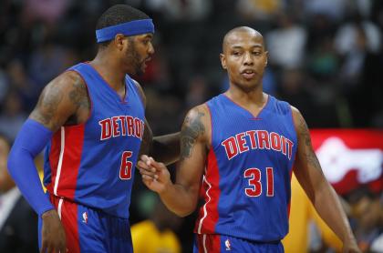 Caron Butler, right, talking to Josh Smith, is joining the Kings. (AP)