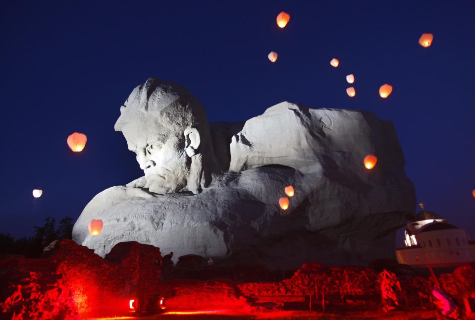 FILE - In this Wednesday June 22, 2011 file photo, lanterns fly over one of the Soviet WWII war monuments marking the heroic resistance of the Soviet Army against the surprise Nazi German attack during a ceremony marking the 70th anniversary of Nazi invasion in the town of Brest, 360 kilometers (223 miles) southwest of Minsk, Belarus. U.S. television network CNN caused a firestorm when it included the war monument in Brest, a city in the former Soviet republic of Belarus, in an article on the “world’s ugliest monuments” published Jan. 24. (AP Photo/Sergei Grits, file)