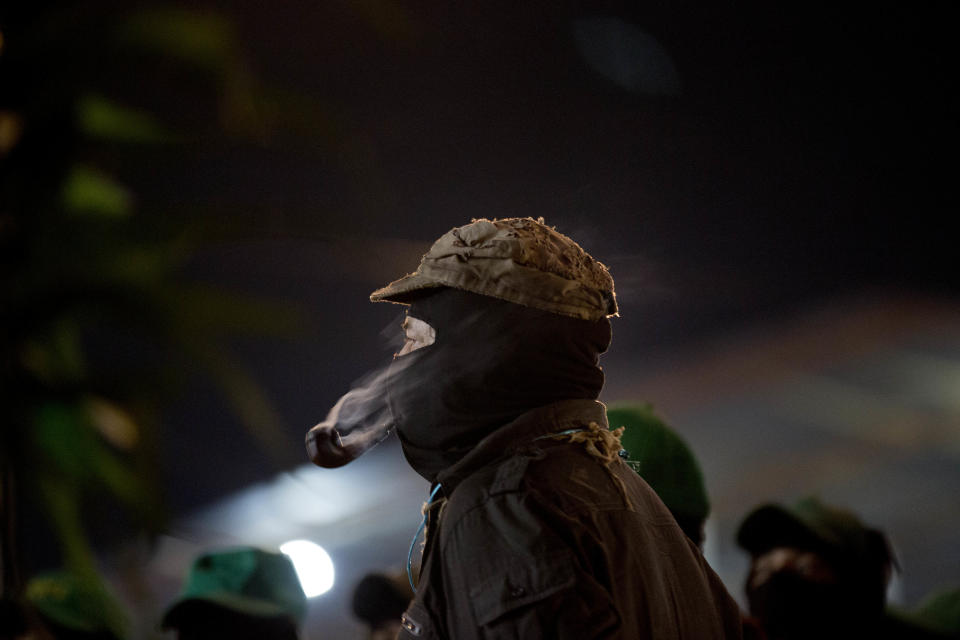 ADDS PRIOR NAME "MARCOS" - Mexican rebel leader Subcomandante Galeano, formerly known as Subcomandante Marcos, attends an event of the Zapatista National Liberation Army, EZLN, marking the 25th anniversary of the Zapatista uprising in La Realidad, Chiapas state, Mexico, Monday, Dec. 31, 2018. (AP Photo/Eduardo Verdugo)