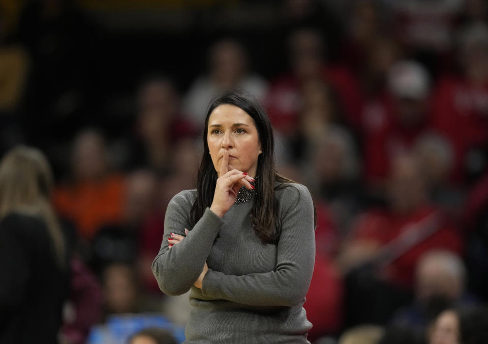 FILE - Nebraska head coach Amy Williams watches from the bench during the second half of an NCAA college basketball game against Iowa, Jan. 27, 2024, in Iowa City, Iowa. Williams and former Nebraska athletic director Trev Alberts said in their joint response to Ashley Scoggin's civil lawsuit, that they had no knowledge of the sexual relationship Scoggin alleged to have with former assistant coach Chuck Love. (AP Photo/Charlie Neibergall, file)