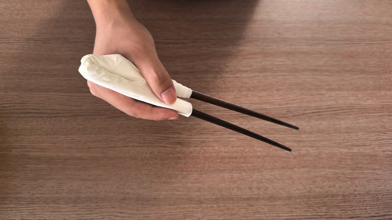 chopsticks with napkin connecting them
