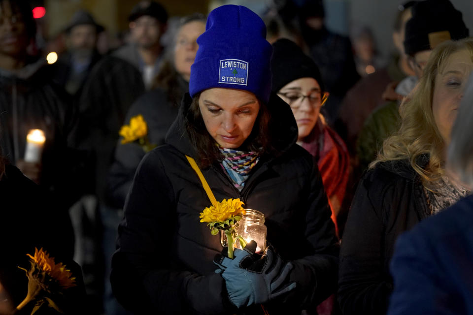 Community members gather Thursday, Nov. 2, 2023, during a candlelight vigil in Auburn, Maine. Locals seek a return to normalcy after a mass shooting in Lewiston on Oct. 25. (AP Photo/Matt York)