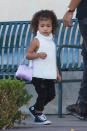 <p>North West decided to give her tutus and Balmain blazers a rest for a more casual shopping outing with her cousin P. On Wednesday, the two-year-old—who kept her little curly locks down and loose—looked trés trendy wearing distressed black denim pants, a sleeveless white turtleneck, and high-top sneakers. Even better, she toted a mini pink satin purse on her arm. (<i>Photo: akmgsi) </i></p>