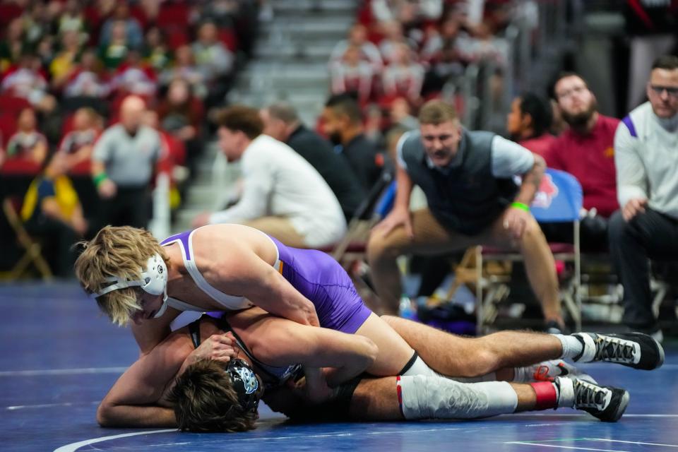 Johnston's Braden Blackorby (top) is a two-time Class 3A state medalist with a 77-14 career record entering his senior season.