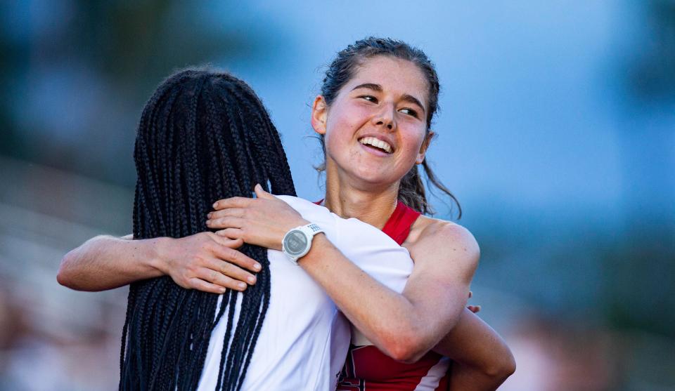 Ava Povich from Evangelical Christian School reacts after winning 3200 meters during the Class 1A-District 12 track meet at ECS.