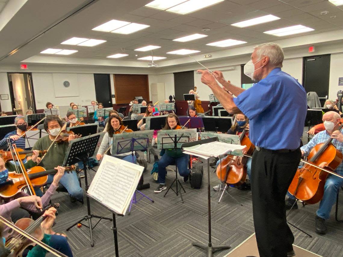 Robert Petters conducts The Really Terrible Orchestra in advance of its Dec. 7 holiday concert in Cary, featuring the Hallelujah Chorus accompanied by kazoos.