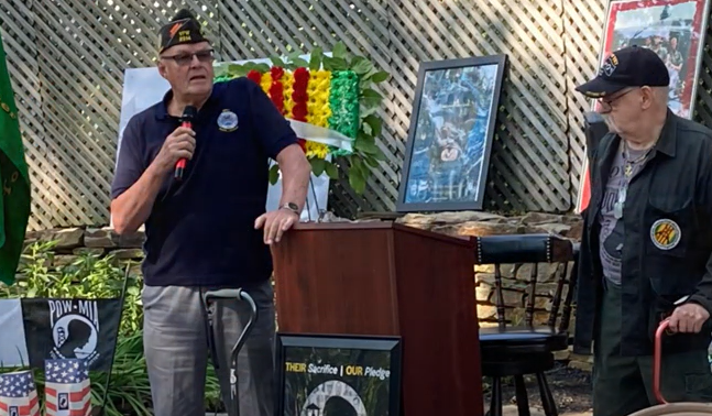 VFW Past National Commander in Chief George Lisicki, left, speaks during the 2022 National POW/MIA Recognition Day Vigil at Memorial Park in Metuchen. U.S. Navy veteran Al Miller is also pictured.