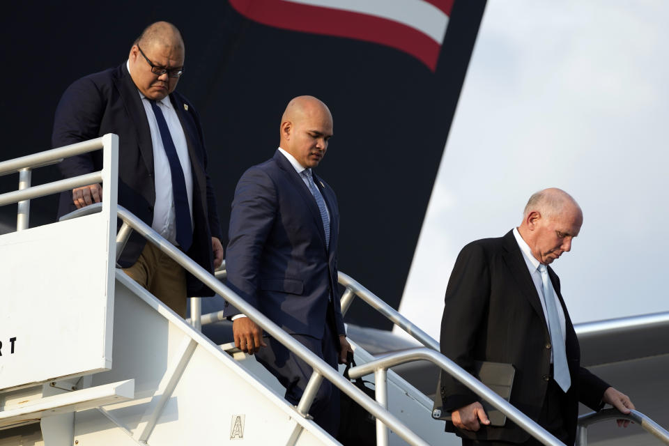 From left, Steven Cheung, Walt Nauta and attorney Steven Sadow walk from the plane after former President Donald Trump arrives at Hartsfield-Jackson Atlanta International Airport, Thursday, Aug. 24, 2023, in Atlanta. (AP Photo/Alex Brandon)