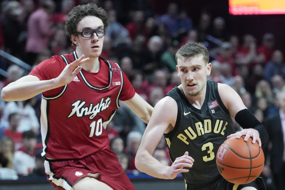 Purdue guard Braden Smith (3) drives against Rutgers guard Gavin Griffiths (10) in the first half of an NCAA college basketball game, Sunday, Jan. 28, 2024, in Piscataway, N.J. (AP Photo/Mary Altaffer)