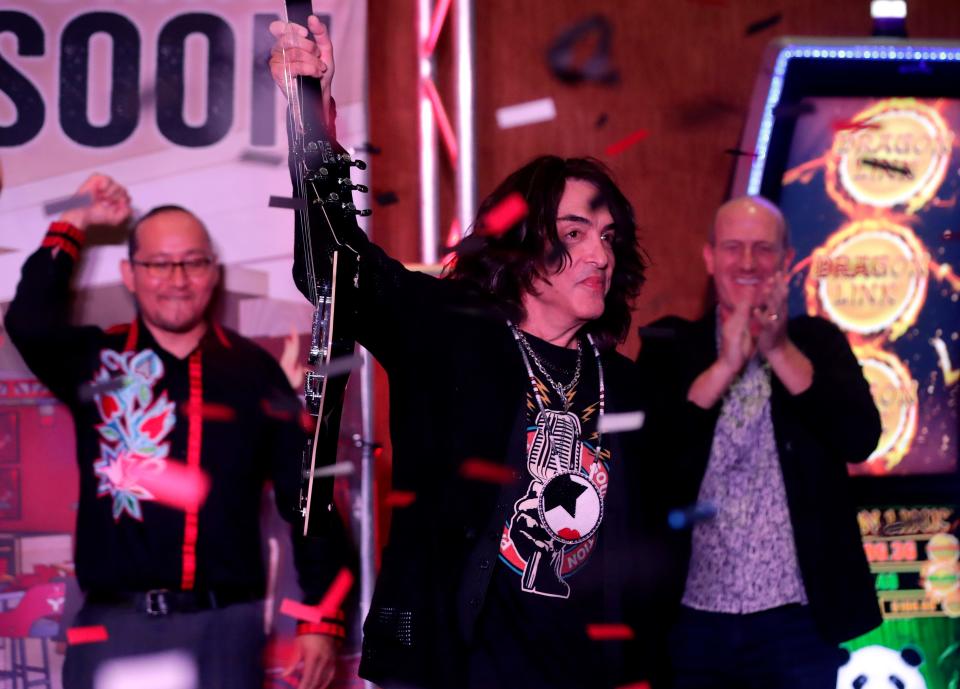 KISS band member Paul Stanley holds up a guitar he smashed during a groundbreaking ceremony for the Rock & Brews restaurant at Potawatomi Casino Hotel Carter on Sept. 1, 2023, in Wabeno, Wis. Sarah Kloepping/USA TODAY NETWORK-Wisconsin