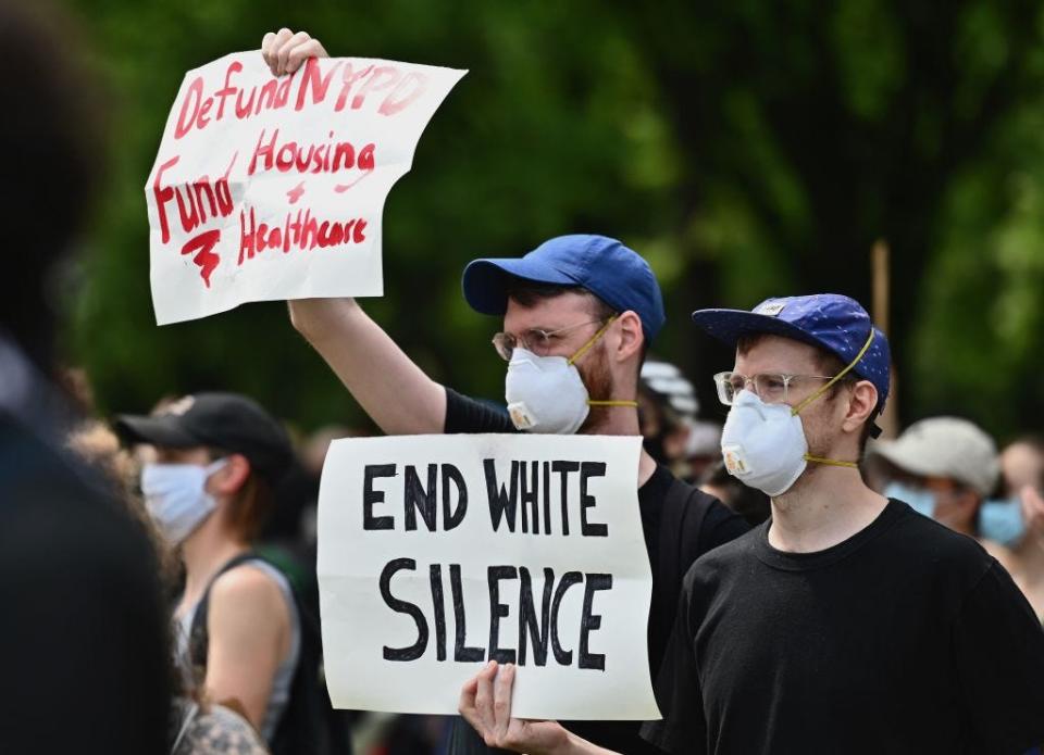 Protesters hold up signs during a Black Lives Matter protest in New York City, on June 3, 2020.