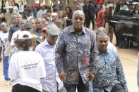 The ruling party CCM presidential candidate Dr. John Magufuli, stands in line to cast his vote at Chamwino in Dodoma Wednesday. Oct. 28, 2020. The populist Magufuli, who made his name in part by targeting corruption, now seeks a second five-year term in one of Africa's most populous and fastest-growing economies. (AP Photo)