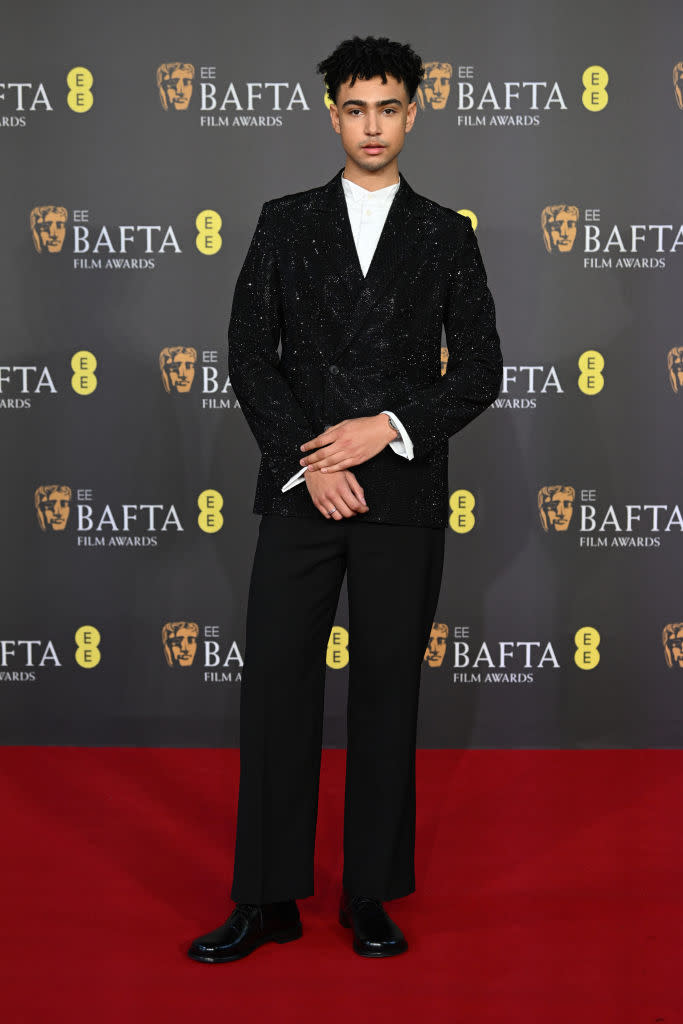 LONDON, ENGLAND - FEBRUARY 18: saltburn actor Archie Madekwe wears sequins suit attends the EE BAFTA Film Awards 2024 at The Royal Festival Hall on February 18, 2024 in London, England. (Photo by Joe Maher/BAFTA/Getty Images for BAFTA)