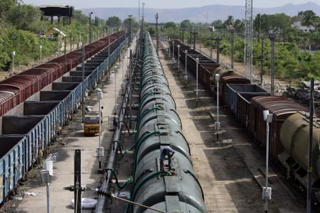 A worker fills a tanker train with water, which will be transported and supplied to drought-hit city of Chennai, at Jolarpettai railway station in the southern state of Tamil Nadu