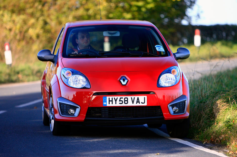 <p>Think <strong>Renaultsport</strong> and most dream of very quick Clios and Meganes, yet rapid Renault fans also have the option of the Twingo Renaultsport. Offered to the world between 2008 and 2013, the Twingo Renaultsport made a virtue of its light weight and <strong>compact</strong> size rather than prodigious power. There was only <strong>131bhp</strong> from the 1.6-litre engine and 0-62mph in 8.7 seconds didn’t look impressive.</p><p>Yet the Twingo was more than the <strong>sum</strong> of its parts. The chassis was agile and could be further stiffened with the optional <strong>Cup</strong> pack or by choosing the Cup model. Either way, the Twingo loved corners and being driven by the <strong>scruff</strong> of its neck. Even so, not even the Twingo Renaultsport’s affordability compared to other quick Renaults could tempt enough buyers, so it was and has remained a rare treat.</p>