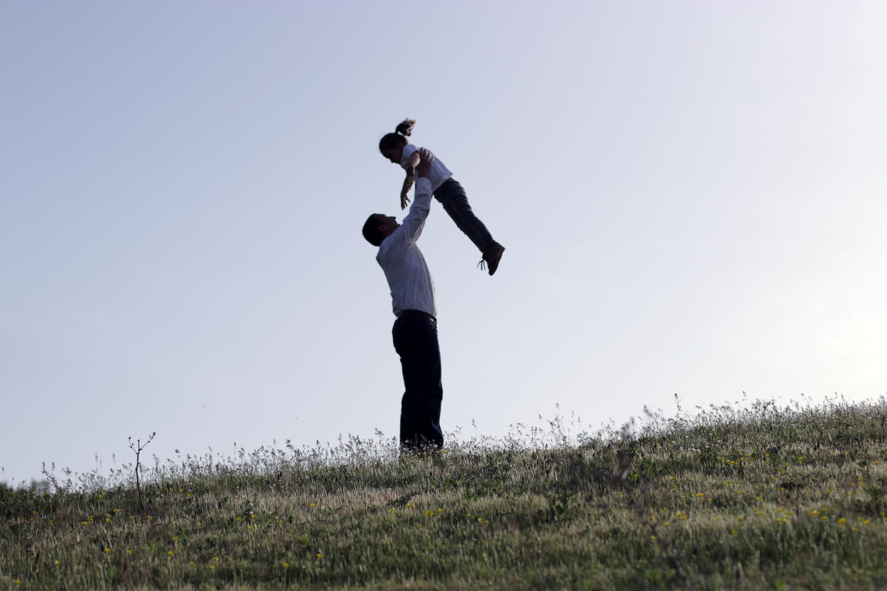 Father is playing with his daughter