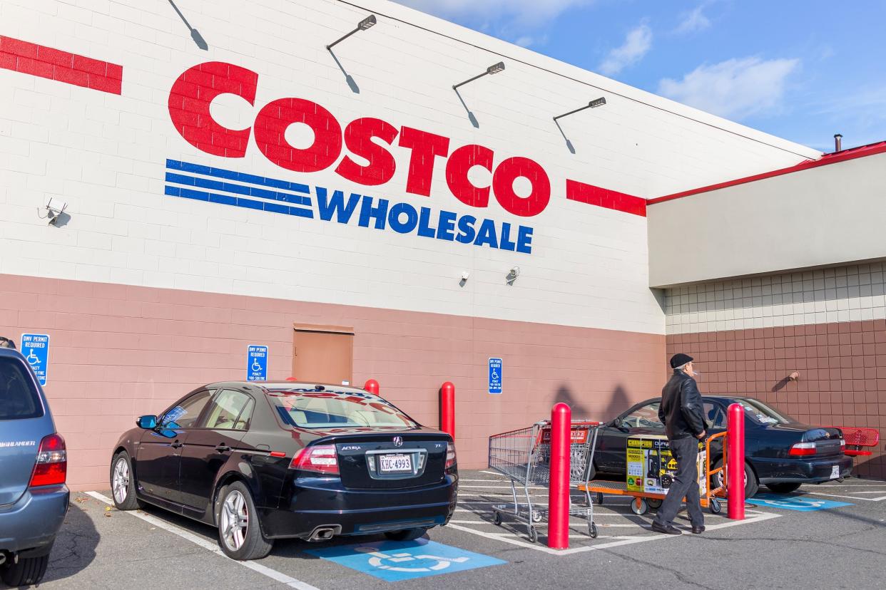 Costco with parked cars and customers walking