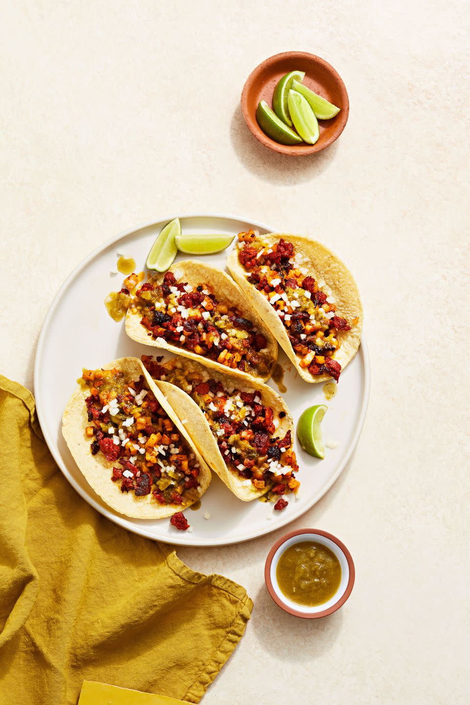 five ingredient crispy chorizo tacos on a platter with dipping sauce