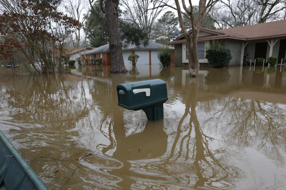 A mailbox stands above the Pearl River floodwater in this northeast Jackson, Miss., neighborhood Sunday, Feb. 16, 2020. (AP Photo/Rogelio V. Solis)