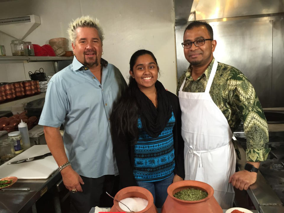 Guy Fieri, Hafsa and Ruhel Islam, when their restaurant was featured on 