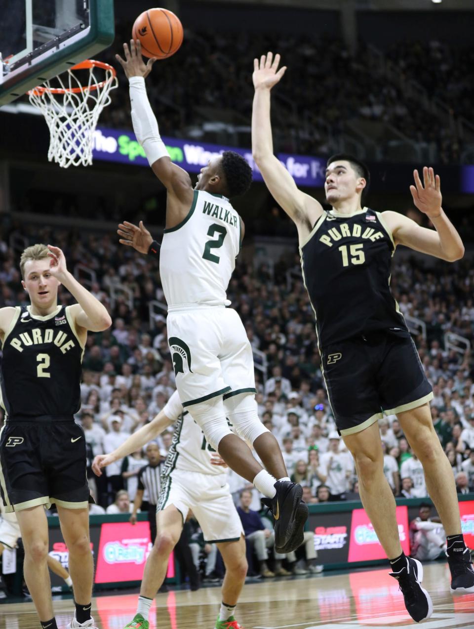 Michigan State guard Tyson Walker scores against Purdue Boilermakers center Zach Edey during the second half Monday, Jan. 16, 2023 at Breslin Center in East Lansing.