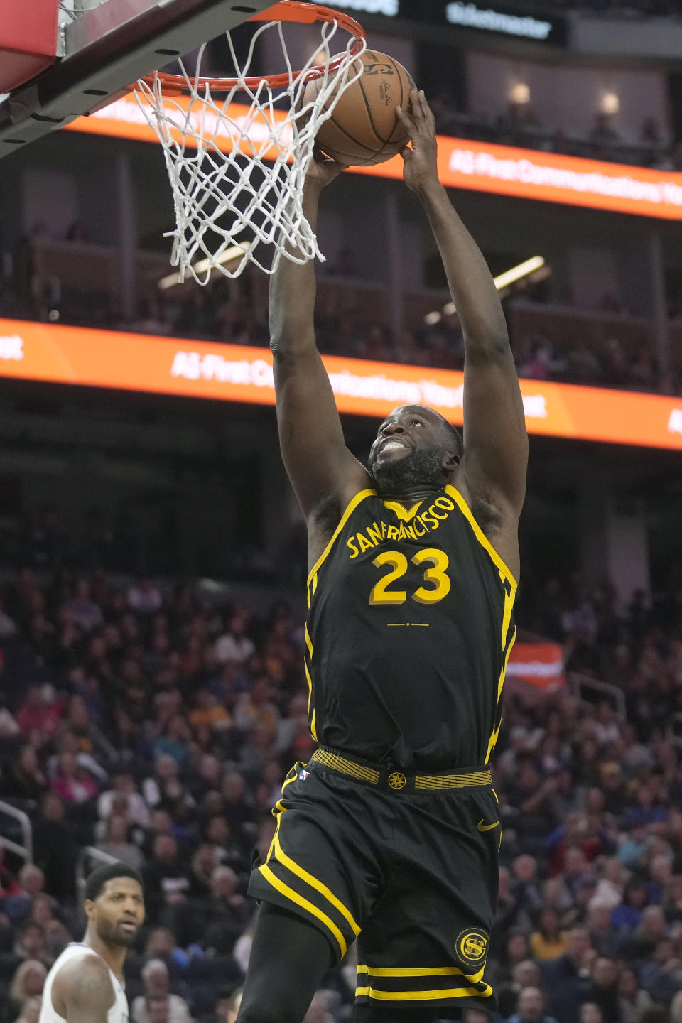 Golden State Warriors forward Draymond Green dunks against the Los Angeles Clippers during the first half of an NBA basketball game in San Francisco, Wednesday, Feb. 14, 2024. (AP Photo/Jeff Chiu)