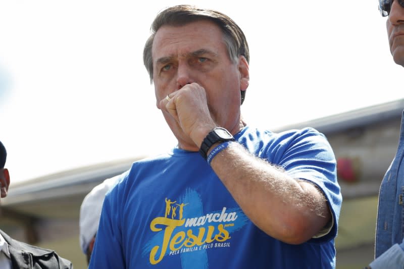 Brazil's President Jair Bolsonaro reacts during an evangelical march for Jesus in Brasilia