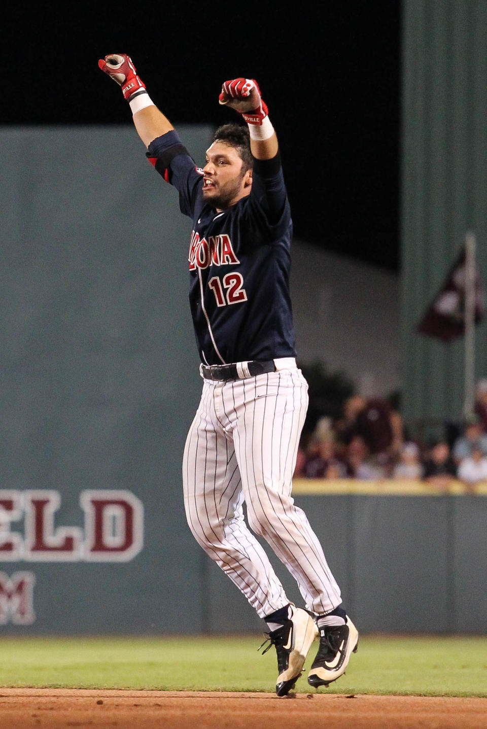 Arizona's Cesar Salazar celebrates his game-winning base hit against Mississippi State during the 11th inning of an NCAA college baseball tournament super regional game in Starkville, Miss., Saturday, June 11, 2016. Arizona won 6-5. (James Pugh/The Laurel Chronicle via AP)