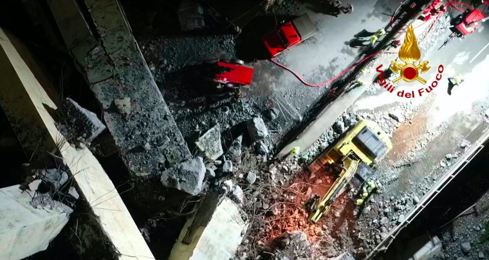 <em>Rescue workers are attempting to reach survivors stuck underneath tonnes of concrete and rubble (AP)</em>