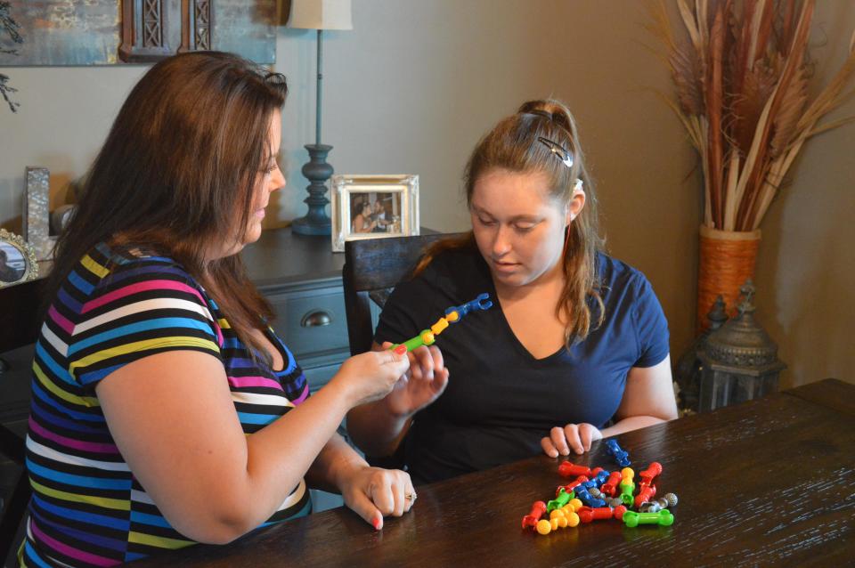 Heather Schmid and her daughter, Ainsley Webb, play together in their De Pere home on August 20, 2022.